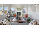 Bright living room with a fireplace, large windows, and stylish furniture and decor at 4825 Basalt Ridge Cir, Castle Rock, CO 80108