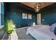 Stylish main bedroom featuring decorative lighting, lots of natural light, and modern decor at 4825 Basalt Ridge Cir, Castle Rock, CO 80108