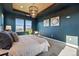 Comfortable main bedroom featuring plush bed, stylish decor, and abundant natural light at 4825 Basalt Ridge Cir, Castle Rock, CO 80108