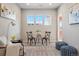 Cozy sitting room with bright natural light, comfortable seating and stylish decor at 4825 Basalt Ridge Cir, Castle Rock, CO 80108