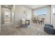 Spacious sitting room with lots of natural light, cozy decor, and comfortable seating at 4825 Basalt Ridge Cir, Castle Rock, CO 80108