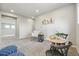 Bright sitting room with natural light, comfortable seating, and stylish decor at 4825 Basalt Ridge Cir, Castle Rock, CO 80108