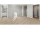 Bright carpeted bedroom with large closet space and ensuite bath at 3036 Oxley St, Strasburg, CO 80136