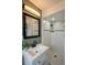 Well-lit bathroom featuring a white vanity, and a tiled shower at 9390 W Alabama Dr, Lakewood, CO 80232
