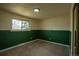 View of a bedroom with two-tone walls, neutral carpeting, and a sliding door closet at 9390 W Alabama Dr, Lakewood, CO 80232