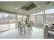 Dining area is lit by natural light from multiple large windows at 9390 W Alabama Dr, Lakewood, CO 80232