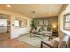Cozy living room with a comfortable seating arrangement and a pass-through to the kitchen at 9390 W Alabama Dr, Lakewood, CO 80232