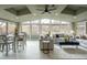 The living room boasts large windows, vaulted ceilings, and a dining area for entertaining at 9390 W Alabama Dr, Lakewood, CO 80232