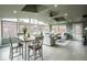 Open floor plan combines living and dining, bathed in natural light from many windows at 9390 W Alabama Dr, Lakewood, CO 80232