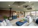 A sunny room with brick accents, modern furnishings, and lots of windows at 9390 W Alabama Dr, Lakewood, CO 80232