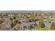 A charming neighborhood featuring townhomes with mature trees, landscaping, and a mountain view at 1055 Milo Cir # A, Lafayette, CO 80026