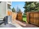 Backyard features wooden gate, a gravel area and patio at 1055 Milo Cir # A, Lafayette, CO 80026