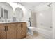 Bright bathroom featuring double sinks, modern vanity, and combined bathtub and shower at 1055 Milo Cir # A, Lafayette, CO 80026