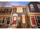 Charming townhouse with an attractive exterior, red shutters, and a well-maintained front yard at 1055 Milo Cir # A, Lafayette, CO 80026