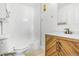 Bathroom with a modern vanity and stylish wood design, tiled shower, and updated fixtures at 381 S Ames St # E305, Lakewood, CO 80226