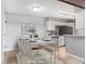 Bright dining area adjacent to the kitchen, featuring modern furnishings at 381 S Ames St # E305, Lakewood, CO 80226