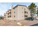 Angled exterior view of a multi-story apartment building featuring stone accents and balconies at 381 S Ames St # E305, Lakewood, CO 80226