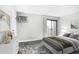 Bright bedroom featuring a sliding glass door leading to a balcony and neutral decor at 381 S Ames St # E305, Lakewood, CO 80226