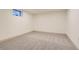Empty basement room with neutral carpet and a small window for natural light at 5975 S Milwaukee Way, Centennial, CO 80121