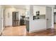 Modern kitchen with stainless steel appliances, custom cabinets, and stylish backsplash at 5975 S Milwaukee Way, Centennial, CO 80121