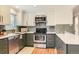 Well-designed kitchen featuring stainless steel appliances and updated cabinetry at 5975 S Milwaukee Way, Centennial, CO 80121