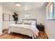 Comfortable main bedroom with light-colored walls, hardwood floors, and stylish decor at 5975 S Milwaukee Way, Centennial, CO 80121