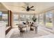 Bright and airy sunroom with a ceiling fan, many windows, and stylish furniture at 5975 S Milwaukee Way, Centennial, CO 80121