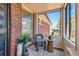 Cozy sunroom with large windows, stylish chair, and decor at 5975 S Milwaukee Way, Centennial, CO 80121