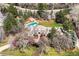 Expansive aerial view showcasing the estate, pool, and lush landscaping at 38 Sedgwick Dr, Cherry Hills Village, CO 80113