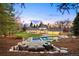 Spacious backyard featuring a pool, hot tub, and seating area, perfect for entertaining at 38 Sedgwick Dr, Cherry Hills Village, CO 80113