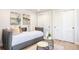 Bedroom with a daybed, dual mirrored side tables, and sliding closet doors at 38 Sedgwick Dr, Cherry Hills Village, CO 80113
