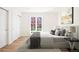Bedroom features hardwood floors, large window and ample natural light at 38 Sedgwick Dr, Cherry Hills Village, CO 80113