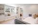 Bright bedroom with built-in shelving, bench, and a comfortable daybed at 38 Sedgwick Dr, Cherry Hills Village, CO 80113