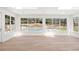 Bonus room with large windows offering a beautiful view of the swimming pool at 38 Sedgwick Dr, Cherry Hills Village, CO 80113