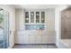 Butler's pantry featuring custom cabinets, a prep area, and glass-front display cases at 38 Sedgwick Dr, Cherry Hills Village, CO 80113