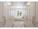 Bright closet featuring custom built-ins, herringbone floors and window seat at 38 Sedgwick Dr, Cherry Hills Village, CO 80113