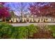 Charming brick home features a well-manicured front yard and a large driveway, perfect for Gathering living at 38 Sedgwick Dr, Cherry Hills Village, CO 80113