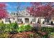 Charming home with a well-manicured front yard and beautiful flowering trees at 38 Sedgwick Dr, Cherry Hills Village, CO 80113