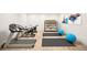 Home gym equipped with a treadmill, stationary bikes, yoga mats, and exercise balls at 38 Sedgwick Dr, Cherry Hills Village, CO 80113