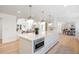 Spacious kitchen with an island, modern lighting, and an open concept design at 38 Sedgwick Dr, Cherry Hills Village, CO 80113