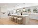 Spacious kitchen features a large island, ample counter space, and barstool seating, perfect for entertaining at 38 Sedgwick Dr, Cherry Hills Village, CO 80113