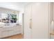 Bright kitchen featuring custom cabinetry, a farmhouse sink, and a view to the backyard at 38 Sedgwick Dr, Cherry Hills Village, CO 80113