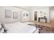 Bright main bedroom featuring ensuite bathroom and bonus room at 38 Sedgwick Dr, Cherry Hills Village, CO 80113