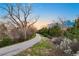 Picturesque path leading through nature, surrounded by trees and foliage at 38 Sedgwick Dr, Cherry Hills Village, CO 80113
