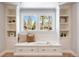 Charming window seat with built-in storage and shelving, offering a cozy spot to relax and enjoy the view at 38 Sedgwick Dr, Cherry Hills Village, CO 80113