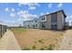 New townhome backyard offers space for a garden and a lovely green space at 19079 E 94Th Pl, Commerce City, CO 80022