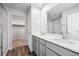 Modern bathroom features double sinks, quartz countertops, and walk-in closet at 19079 E 94Th Pl, Commerce City, CO 80022