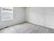 Bright bedroom with large window and neutral carpeting provides a serene space at 19079 E 94Th Pl, Commerce City, CO 80022