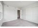Bedroom offering neutral carpet, double door closet, and a door to a room at 19079 E 94Th Pl, Commerce City, CO 80022