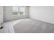 Spacious bedroom with large window and plush carpeting at 19079 E 94Th Pl, Commerce City, CO 80022